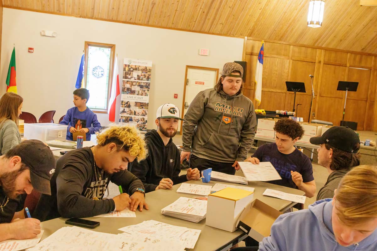 MACU students writing letters for Ferocious Fighter Kits for children with CRPS