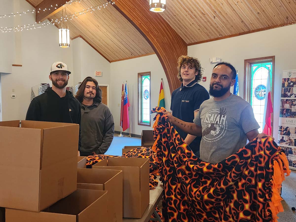 MACU students packing Ferocious Fighter Kits with blankets for children with CRPS
